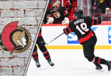 Ottawa Senators star Tim Stützle skates with the puck during an NHL game, looking to make a play in the offensive zone for the 2025-26 season.