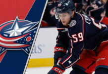 Columbus Blue Jackets forward Yegor Chinakhov skating during a game, amidst rumors of a trade request.