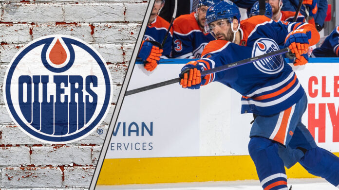Evan Bouchard in an Edmonton Oilers jersey, taking a slap shot on the power play, emphasizing offensive skill and point production for 2025-26.
