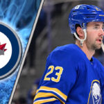 Mattias Samuelsson Rumors: Could This Sabres Defenseman Be the Jets’ Secret Weapon? An image of Mattias Samuelsson in his Buffalo Sabres jersey, looking focused during a game, with the Winnipeg Jets logo in the background.