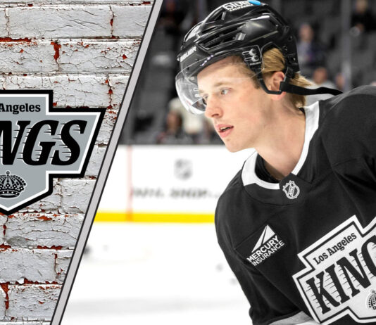 LA Kings defenseman Brandt Clarke skates with the puck during an NHL game