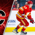 The Risky Standoff: Why Connor Zary’s Contract Will Make or Break the Calgary Flames’ Next Era Calgary Flames forward Connor Zary skating with the puck during an NHL game, looking determined