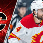 Calgary Flames defenseman Rasmus Andersson skating during a game, central to the latest NHL trade rumors