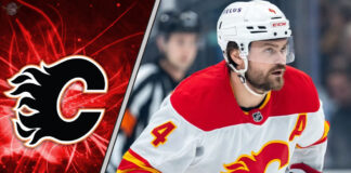 Calgary Flames defenseman Rasmus Andersson skating during a game, central to the latest NHL trade rumors