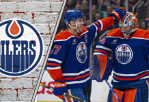 Edmonton Oilers captain Connor McDavid congratulates Stuart Skinner during a game as NHL trade rumors swirl around the team