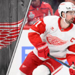 Dylan Larkin skating with the Detroit Red Wings, preparing for the 2025-26 NHL season