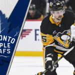 Erik Karlsson skates with the puck, looking for a passing lane, representing the offensive firepower he could bring to the Toronto Maple Leafs.