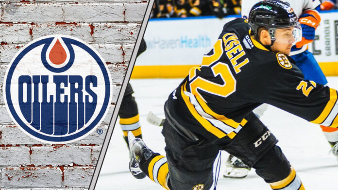 An action shot of Boston Bruins forward Fabian Lysell skating during an NHL game, with Edmonton Oilers logo to the left