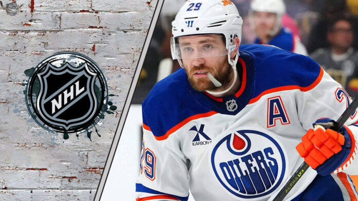 Leon Draisaitl skating with the puck with the NHL logo to his left