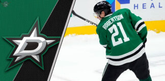 Dallas Stars forward Jason Robertson skates with the puck during an NHL game.