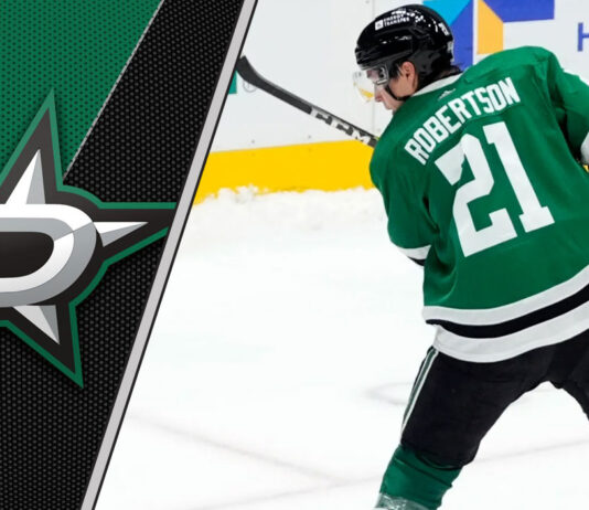 Dallas Stars forward Jason Robertson skates with the puck during an NHL game.