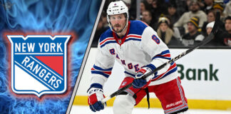 JT Miller skating with the New York Rangers logo in the background
