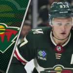 Minnesota Wild forward Kirill Kaprizov skates during an NHL game, with a focus on the ongoing contract rumors surrounding him