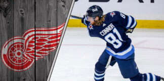 Winnipeg Jets forward Kyle Connor skates during an NHL game, fueling NHL trade rumors about his next contract and a potential move to the Detroit Red Wings.