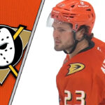The Unsigned Star: Are the Ducks on the Brink of Trading Mason McTavish? Anaheim Ducks center Mason McTavish skates with the puck during an NHL game, with Anaheim Ducks logo in the background