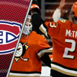 Mason McTavish of the Anaheim Ducks skates with the puck, amidst NHL trade rumors linking him to the Montreal Canadiens.