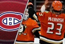 Mason McTavish of the Anaheim Ducks skates with the puck, amidst NHL trade rumors linking him to the Montreal Canadiens.