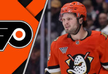 Mason McTavish in an Anaheim Ducks jersey skating with the Philadelphia Flyers logo to the left