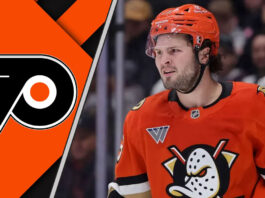 Mason McTavish in an Anaheim Ducks jersey skating with the Philadelphia Flyers logo to the left