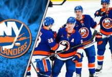 New York Islanders logo with the team celebrating a win on the ice