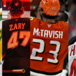 Latest on the Big Four NHL Restricted Free Agents Without Deals Image of NHL players Luke Hughes, Marco Rossi, Mason McTavish, and Connor Zary looking determined.