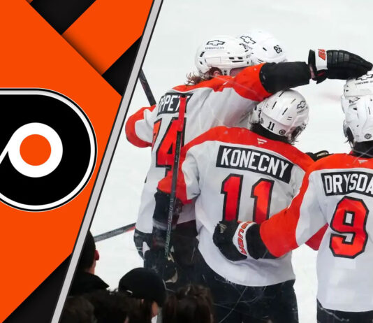 A close-up shot of the Philadelphia Flyers logo on a player's jersey during a game