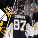An action shot of Sidney Crosby and Evgeni Malkin skating in their Pittsburgh Penguins uniforms
