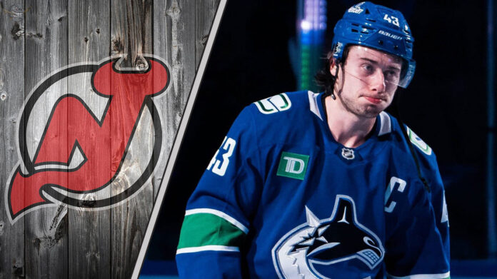 Could the Devils Afford a Hughes Trio? Vancouver Canucks captain Quinn Hughes looking upset on the ice, amidst swirling NHL trade rumors
