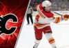 Calgary Flames defenseman Rasmus Andersson taking a shot during an NHL game, with a focus on the ongoing NHL trade rumors surrounding him
