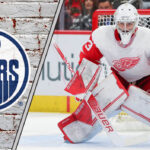 Beyond Hart: Are the Oilers Cooking Up a Blockbuster Goalie Trade with Detroit? Sebastian Cossa getting ready to make a save with the Oilers logo to the left of the Cossa image