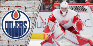 Sebastian Cossa getting ready to make a save with the Oilers logo to the left of the Cossa image