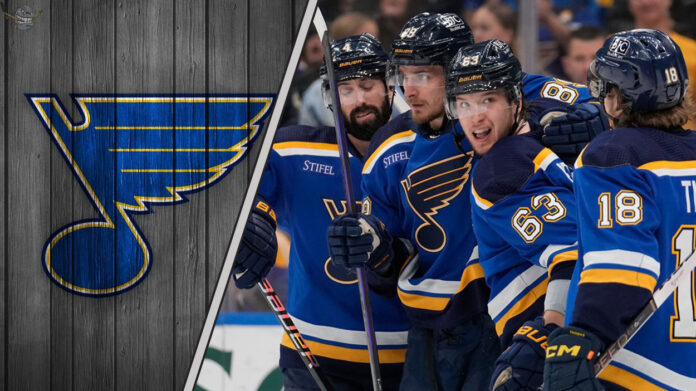 St. Louis Blues players celebrating a goal on the ice