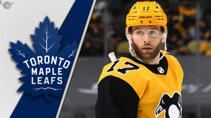 Why Bryan Rust is the Perfect Fit for the Maple Leafs' Top Six Pittsburgh Penguins forward Bryan Rust look on during an NHL game, with a focus on the ongoing NHL trade rumors surrounding him.