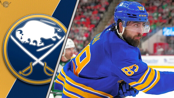 Alex Tuch, Buffalo Sabres forward, taking a shot during an NHL game, with intense focus, reflecting his projected strong 2025-26 season.