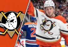Anaheim Ducks forward Mason McTavish celebrates a goal during an NHL game, focused and determined.