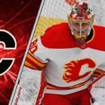 Calgary Flames goalies Devin Cooley making a save as he battles for the back-up goalie job