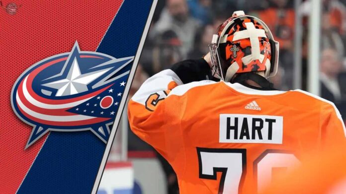carter-hart-flyers-goalie-columbus-rumors-2025 Goaltender Carter Hart in his Philadelphia Flyers jersey, looking focused during a game, as he's rumored to be signing with the Columbus Blue Jackets.