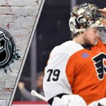 The Carter Hart Redemption Tour: 3 Teams Battling to Sign the Controversial Goalie A focused Carter Hart in his Philadelphia Flyers goalie gear thinking about possible free agent destinations