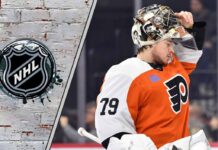 A focused Carter Hart in his Philadelphia Flyers goalie gear thinking about possible free agent destinations