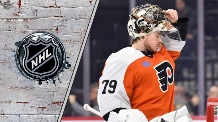 A focused Carter Hart in his Philadelphia Flyers goalie gear thinking about possible free agent destinations