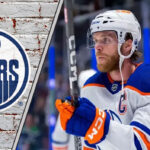 Edmonton Oilers captain Connor McDavid looking focused during a game, contemplating his future with the team amid contract extension talks.