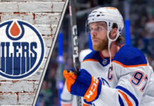 Edmonton Oilers captain Connor McDavid looking focused during a game, contemplating his future with the team amid contract extension talks.