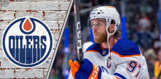 Edmonton Oilers captain Connor McDavid looking focused during a game, contemplating his future with the team amid contract extension talks.