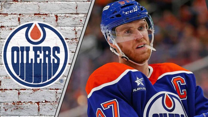 connor-mcdavid-edmonton-oilers-toronto-maple-leafs-contract-decision dmonton Oilers captain Connor McDavid looks on thoughtfully during a game, contemplating his future with the team and a potential move to the Toronto Maple Leafs.