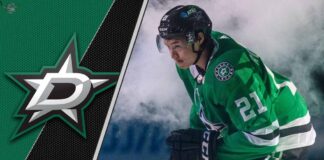 Dallas Stars forward Jason Robertson skates with the puck during an NHL game, focused on the play.