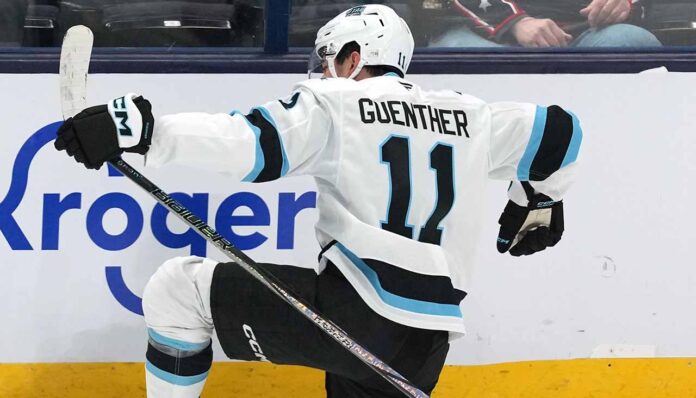 dylan-guenther-utah-mammoth-2025-26-projection Utah Mammoth forward Dylan Guenther celebrating a goal during an NHL game, poised for his 2025-26 breakout season.