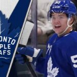 An action shot of Toronto Maple Leafs prospect Easton Cowan skating with the puck