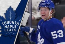 An action shot of Toronto Maple Leafs prospect Easton Cowan skating with the puck