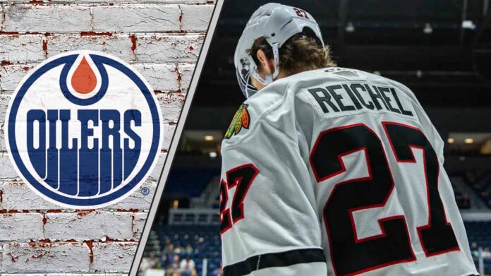 Chicago Blackhawks forward Lukas Reichel skates with his head down thinking about the latest NHL trade rumors about him