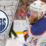 Edmonton Oilers defenseman Mattias Ekholm skating during an NHL game, focused on the play.